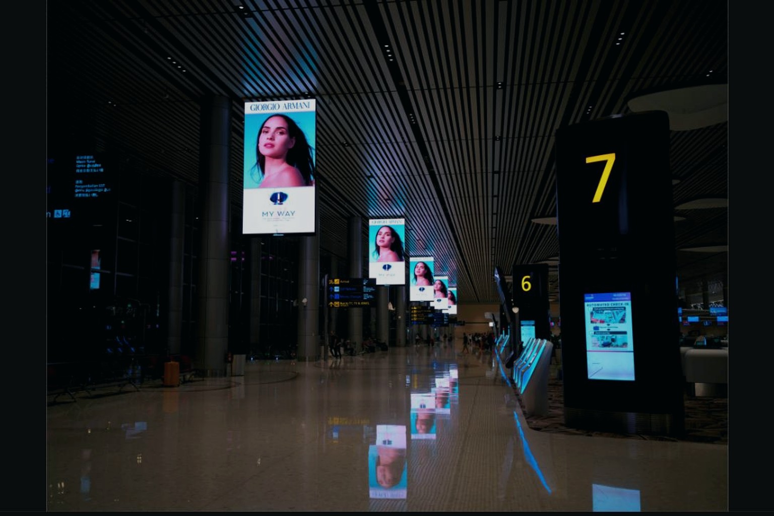 Digital signage screens in a modern transit hall